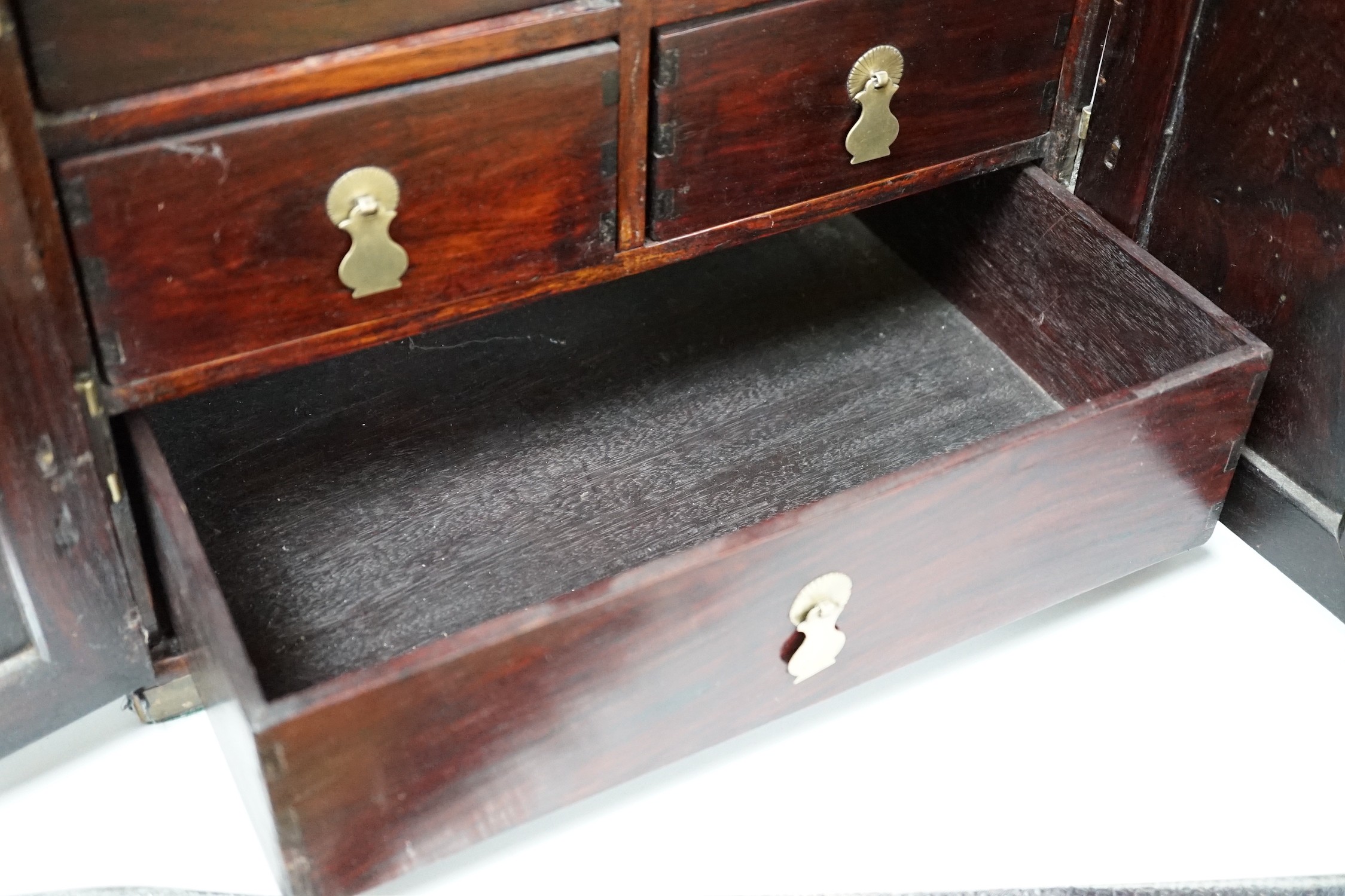 A Chinese brass mounted huanghuali and hardwood seal cabinet, Qing dynasty